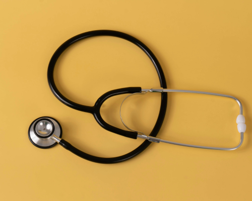 A stethoscope on a yellow background
